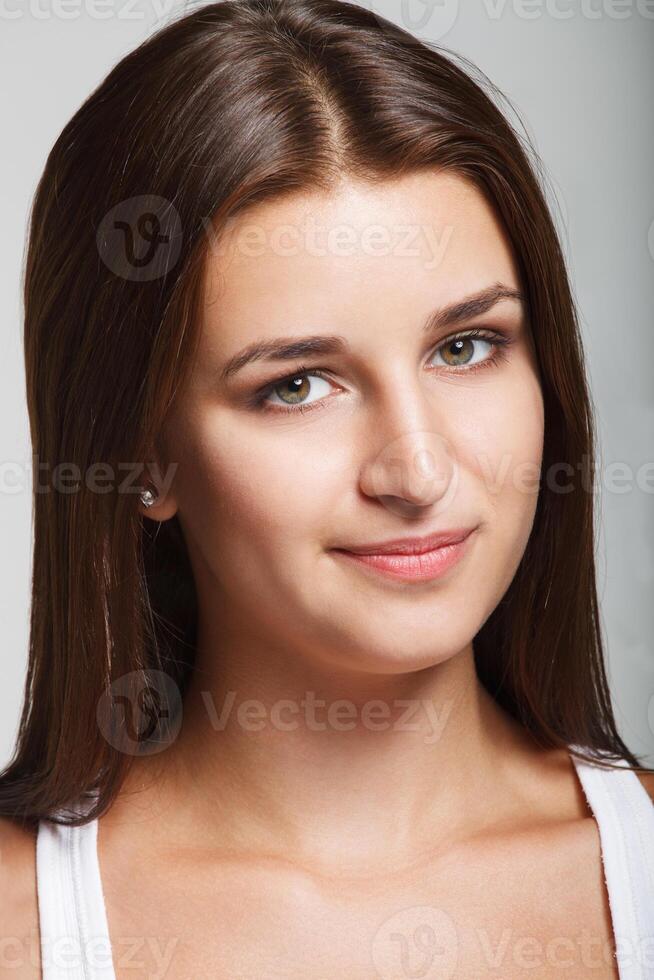 Portrait of a young smiling girl photo