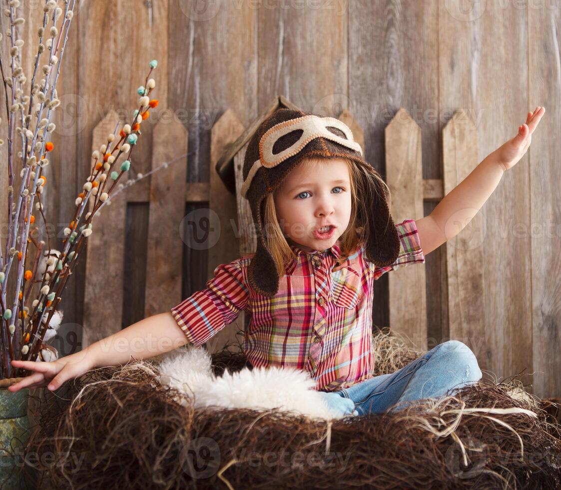 Happy kid playing in pilot helmet photo