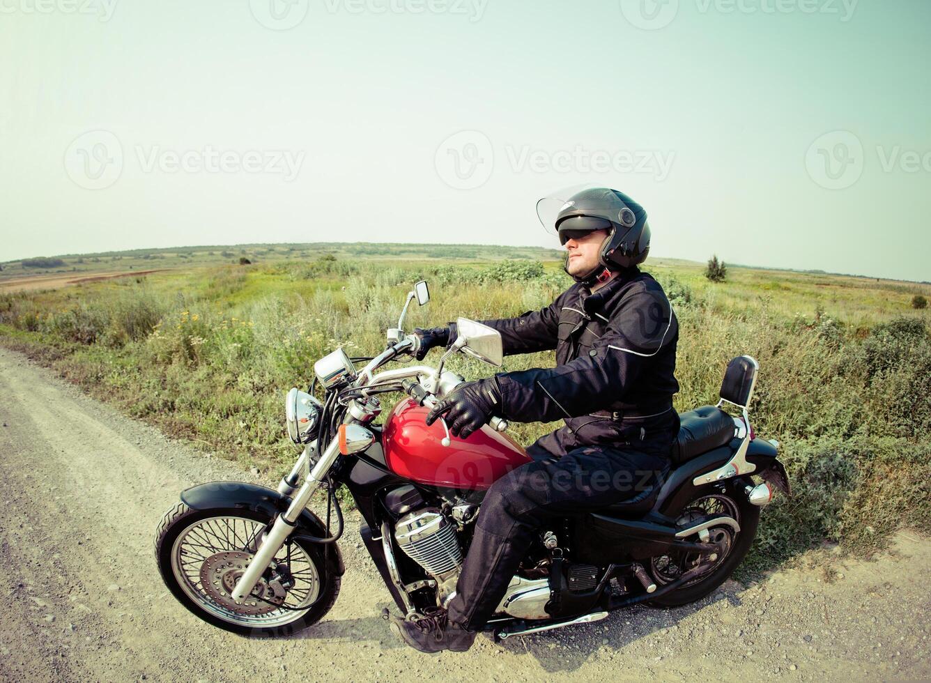 Biker on the country road photo