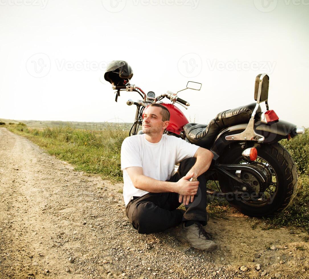Biker on the country road photo