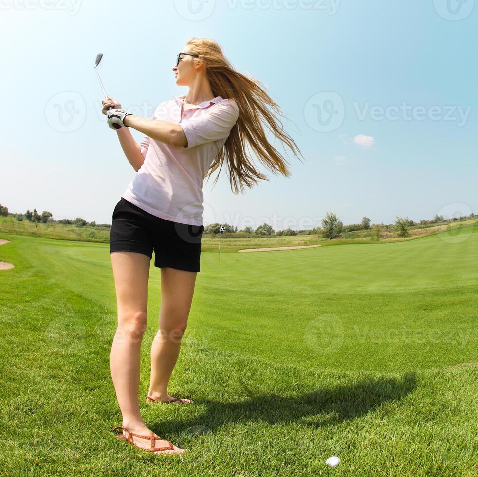 Female golf player at the course photo
