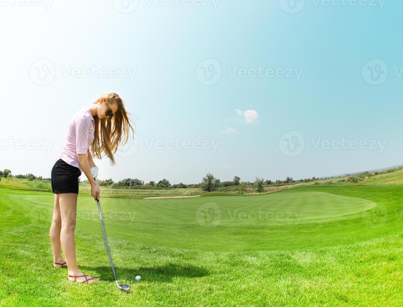 Female golf player at the course photo