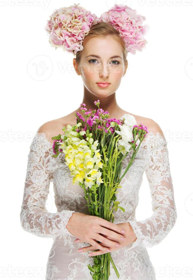 Beautiful blond girl with hydrangea in her hair photo