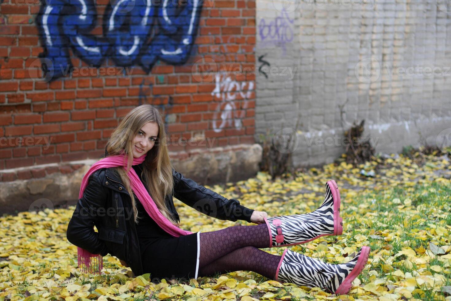 The girl in the pink scarf and boots photo