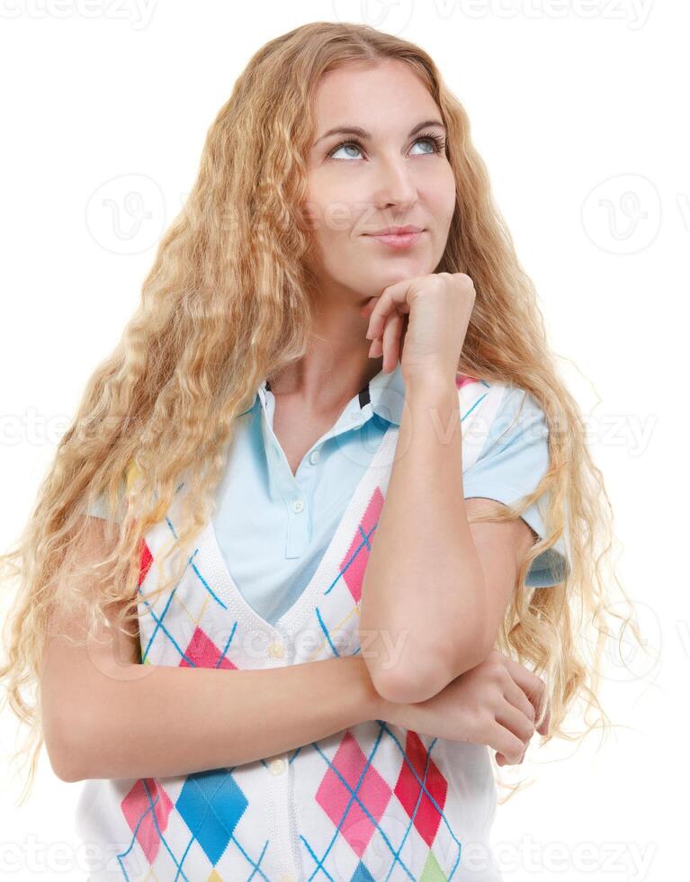 Beautiful thoughtful blond woman looking up photo