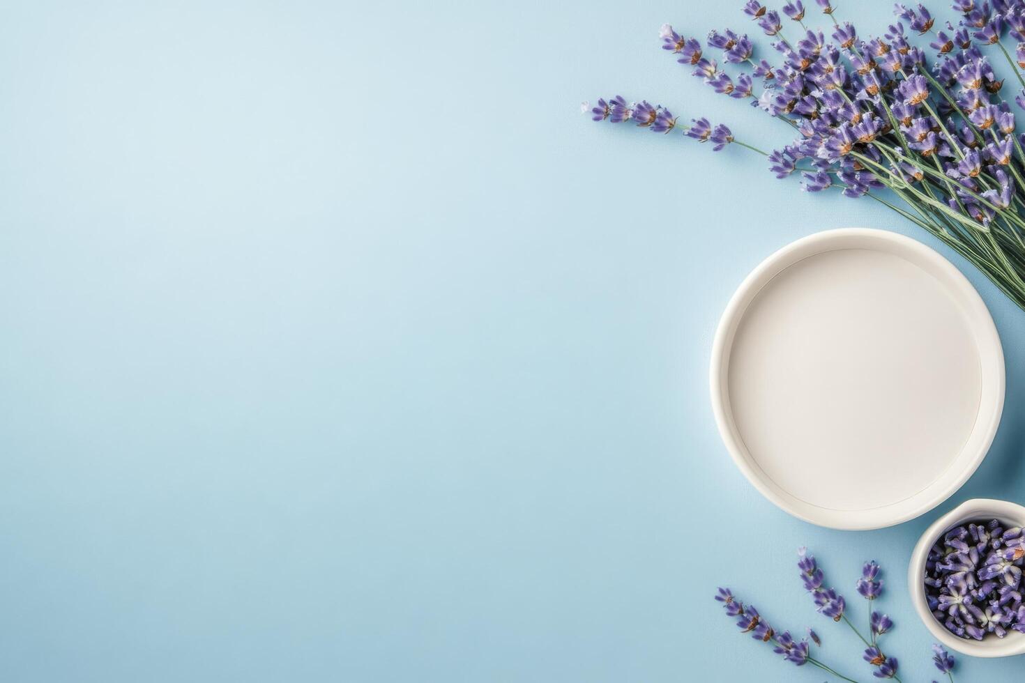Fresh lavender arrangement with bowls on light blue background for creative projects photo