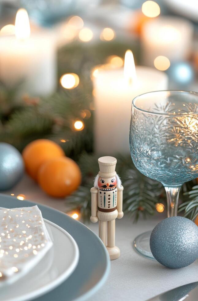 A festive table with candles, holiday decor, and a charming nutcracker on display photo
