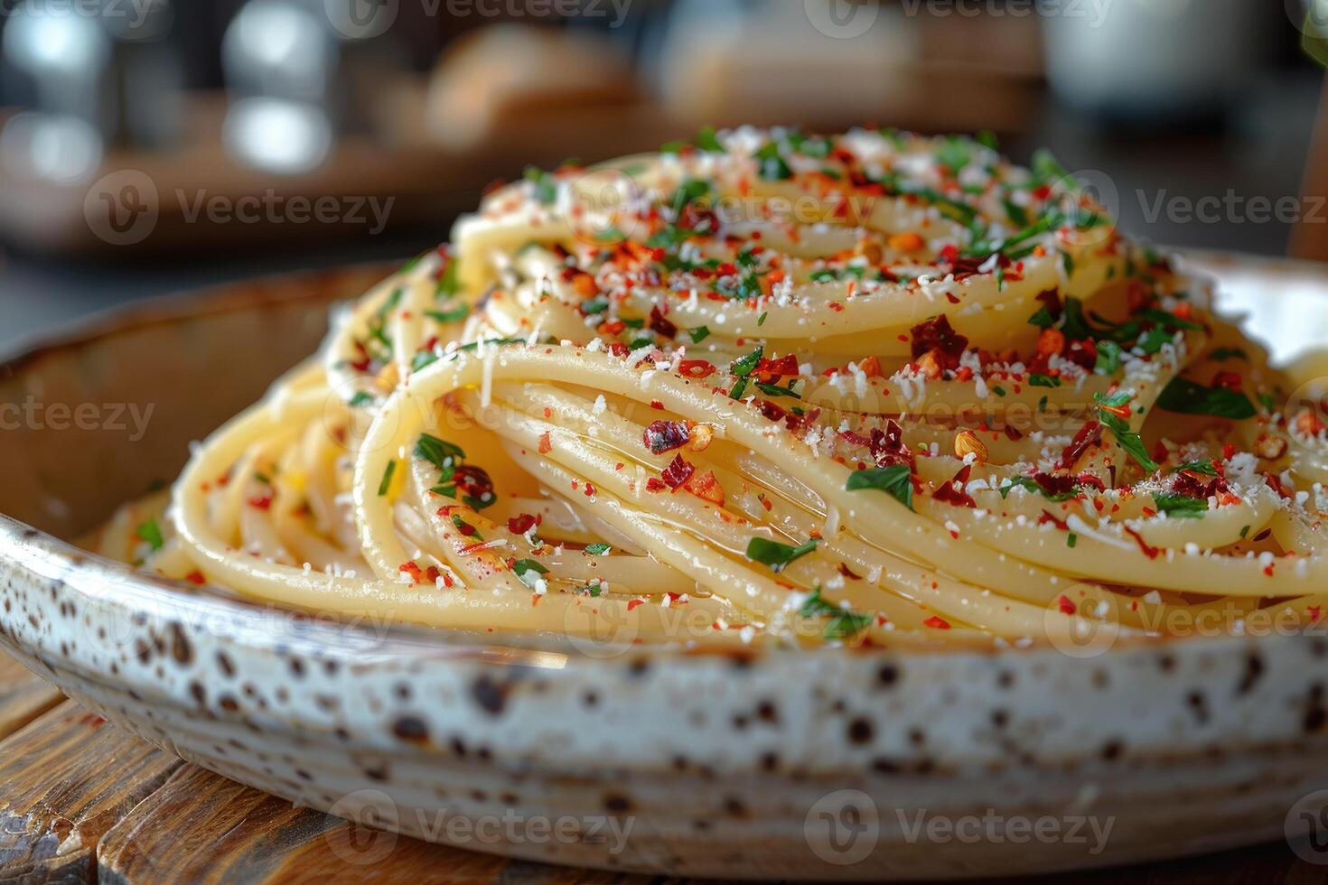 Close-up of Spaghetti with Red Pepper Flakes, Parsley, and Parmesan Cheese photo