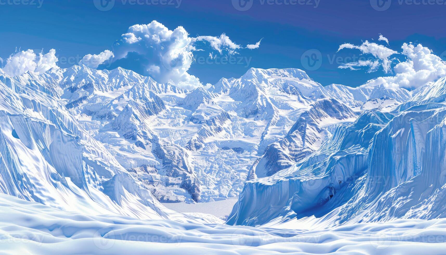 Snow-Covered Mountains with Blue Sky and Clouds photo