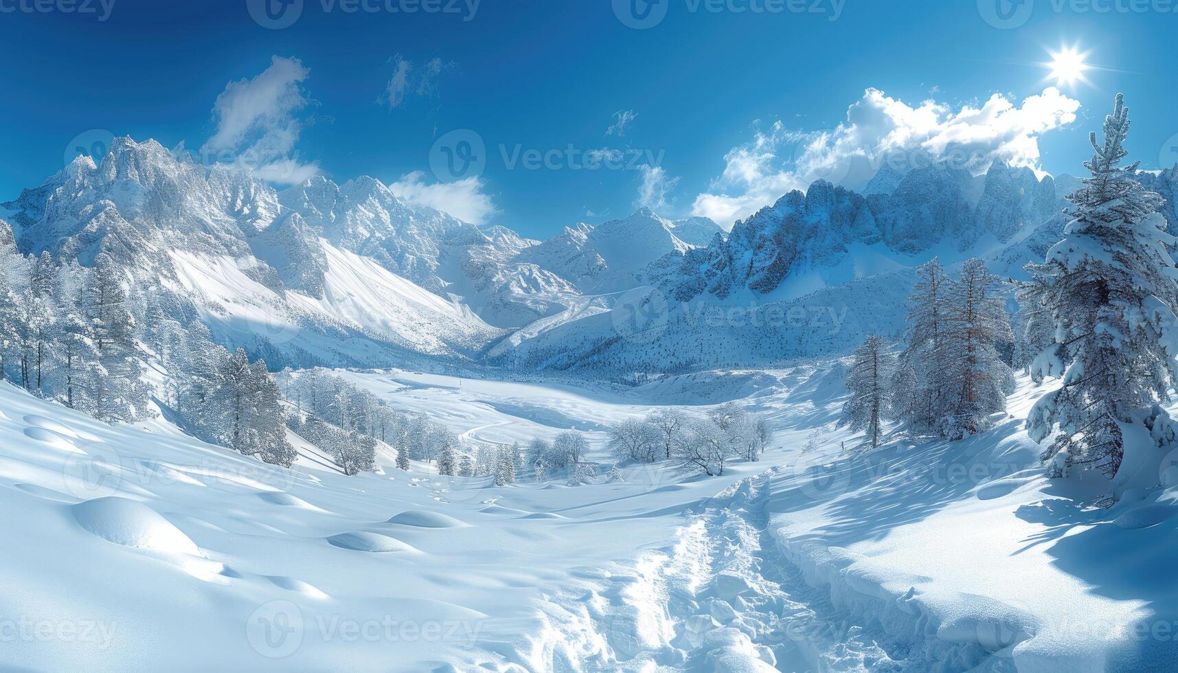 Snow-Covered Mountain Valley with Bright Blue Sky and Sun photo