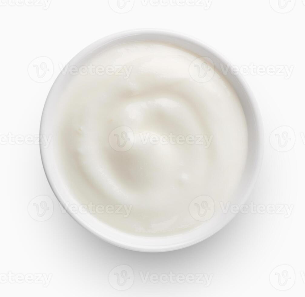 Bowl of yogurt on white background, top view photo