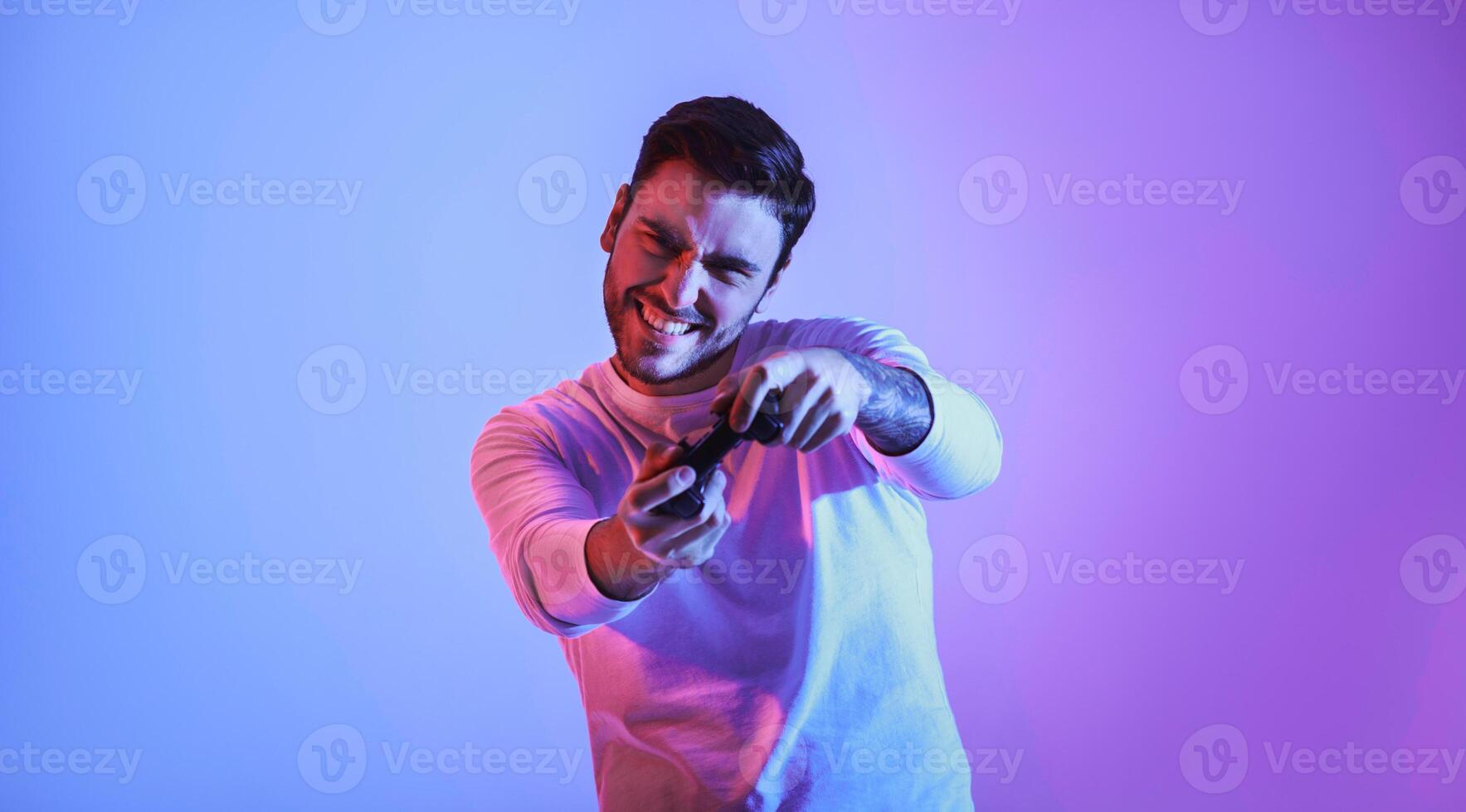 Happy guy with gamepad plays an online game, panorama photo