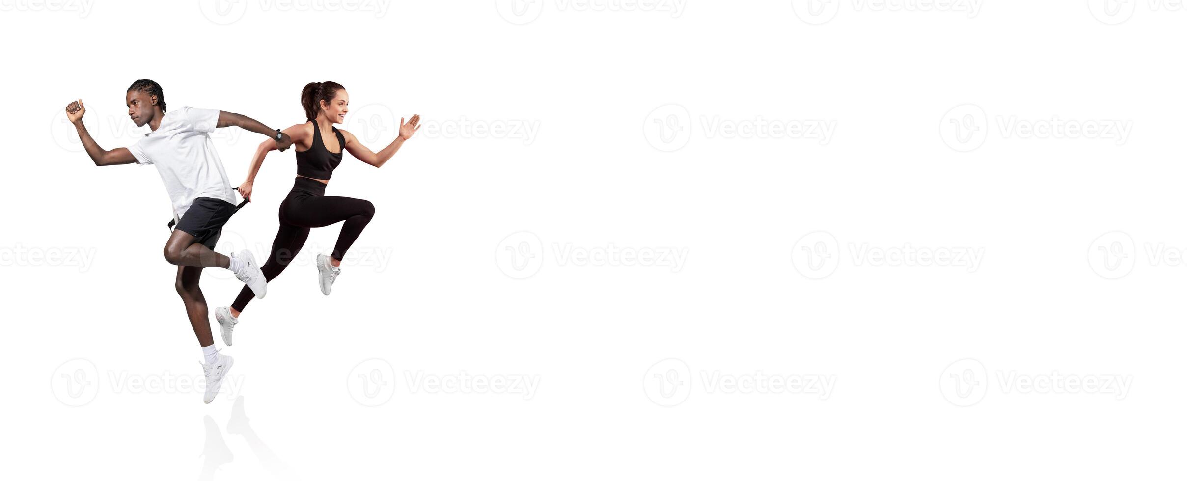 A young couple engages in a running workout, showcasing their energy and teamwork. They are dressed in athletic wear, completely focused and enjoying the exercise session. photo