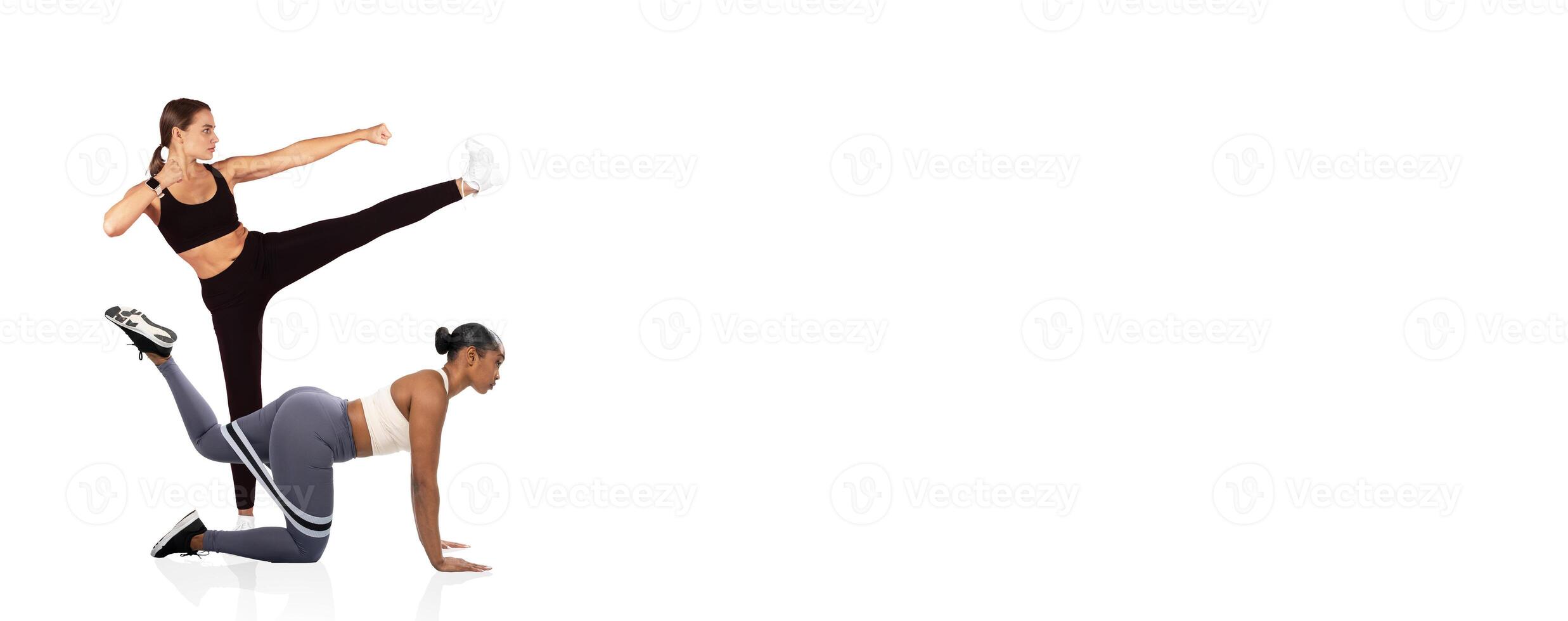 Two women are engaged in a fitness training session, showcasing dynamic exercises. One performs a high kick while the other is on all fours, demonstrating strength and coordination. photo