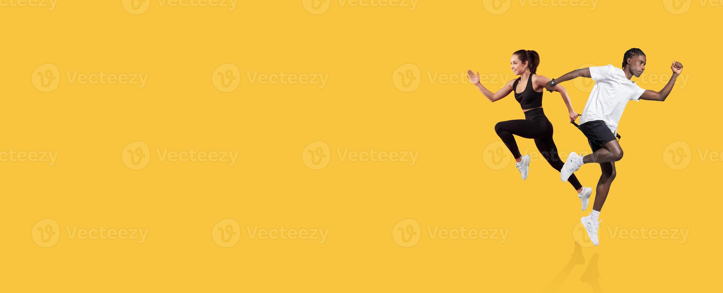 Two dynamic runners sprint with enthusiasm, showcasing their athleticism. They are focused and determined, highlighting an energetic workout environment perfect for fitness inspiration. photo