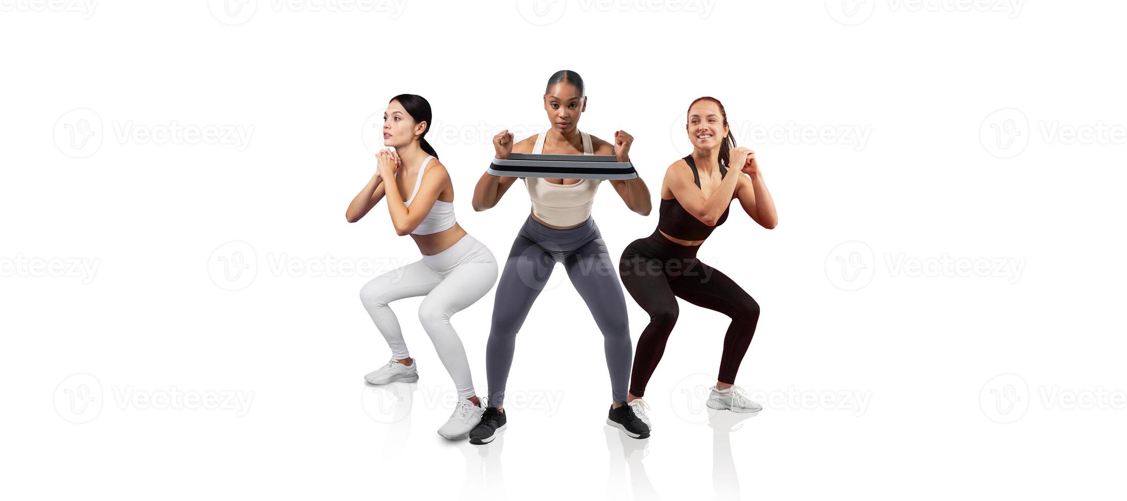 Three women are engaged in a workout routine, performing squats while holding weights. The bright, minimalist studio creates an energetic atmosphere for fitness activities. photo