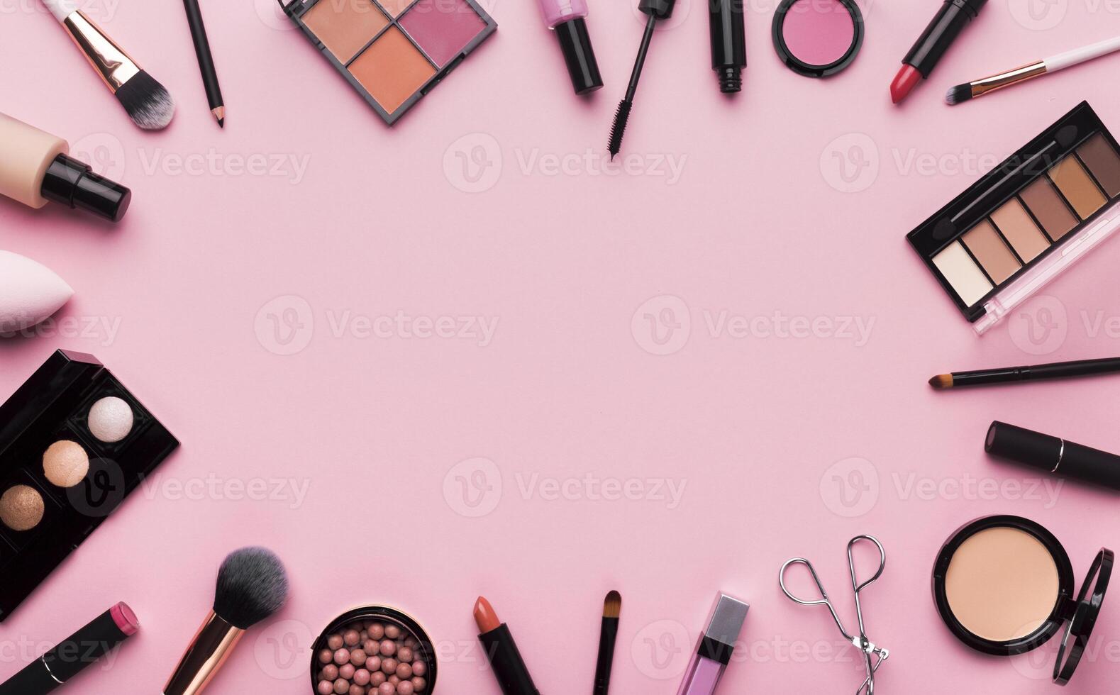 Girlish stuff. Frame of professional cosmetics and brushes around blank space for advertisement photo