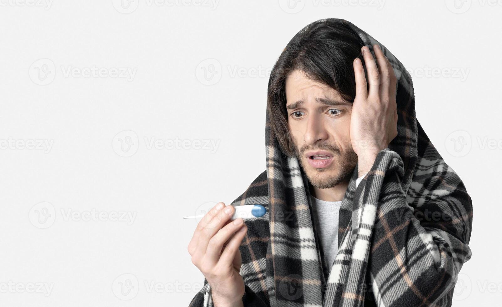 High fever during flu. Shocked man with blanket, free space photo