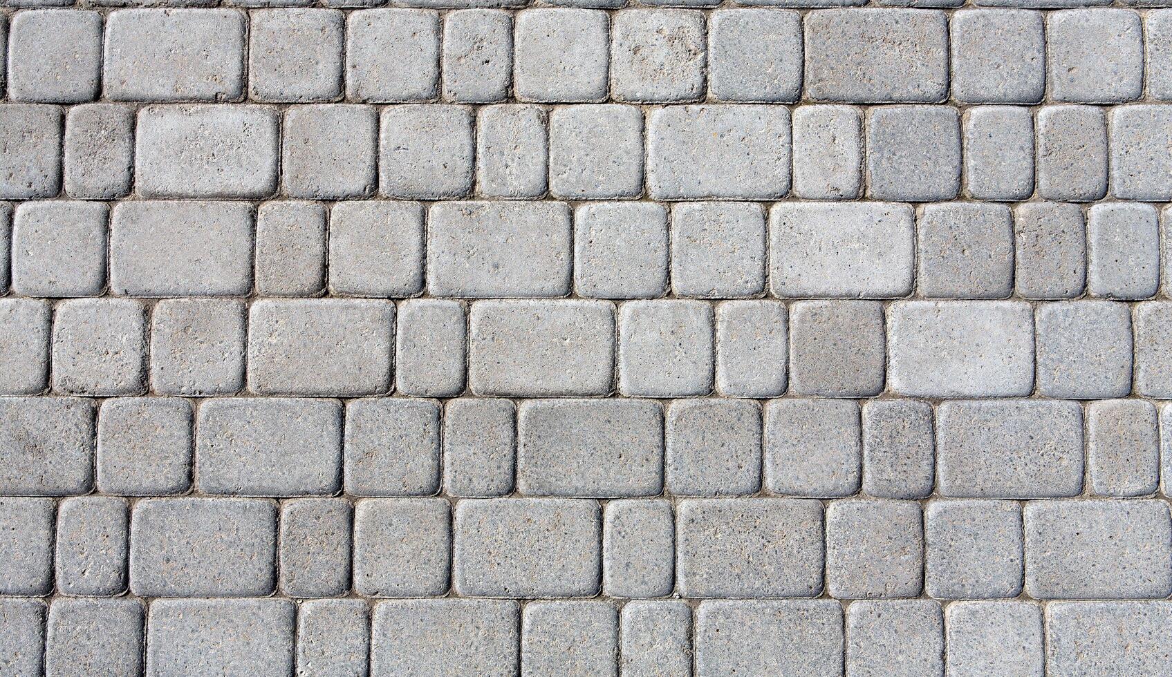 Stone paving texture. Abstract structured background of modern street pavement slabs pattern photo