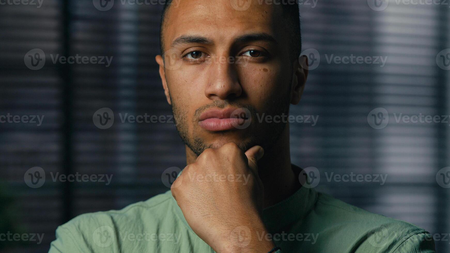 Portrait serious pensive thoughtful african american man businessman entrepreneur leader standing indoors looking camera thinking pondering about business idea ethnic guy think search problem solution photo