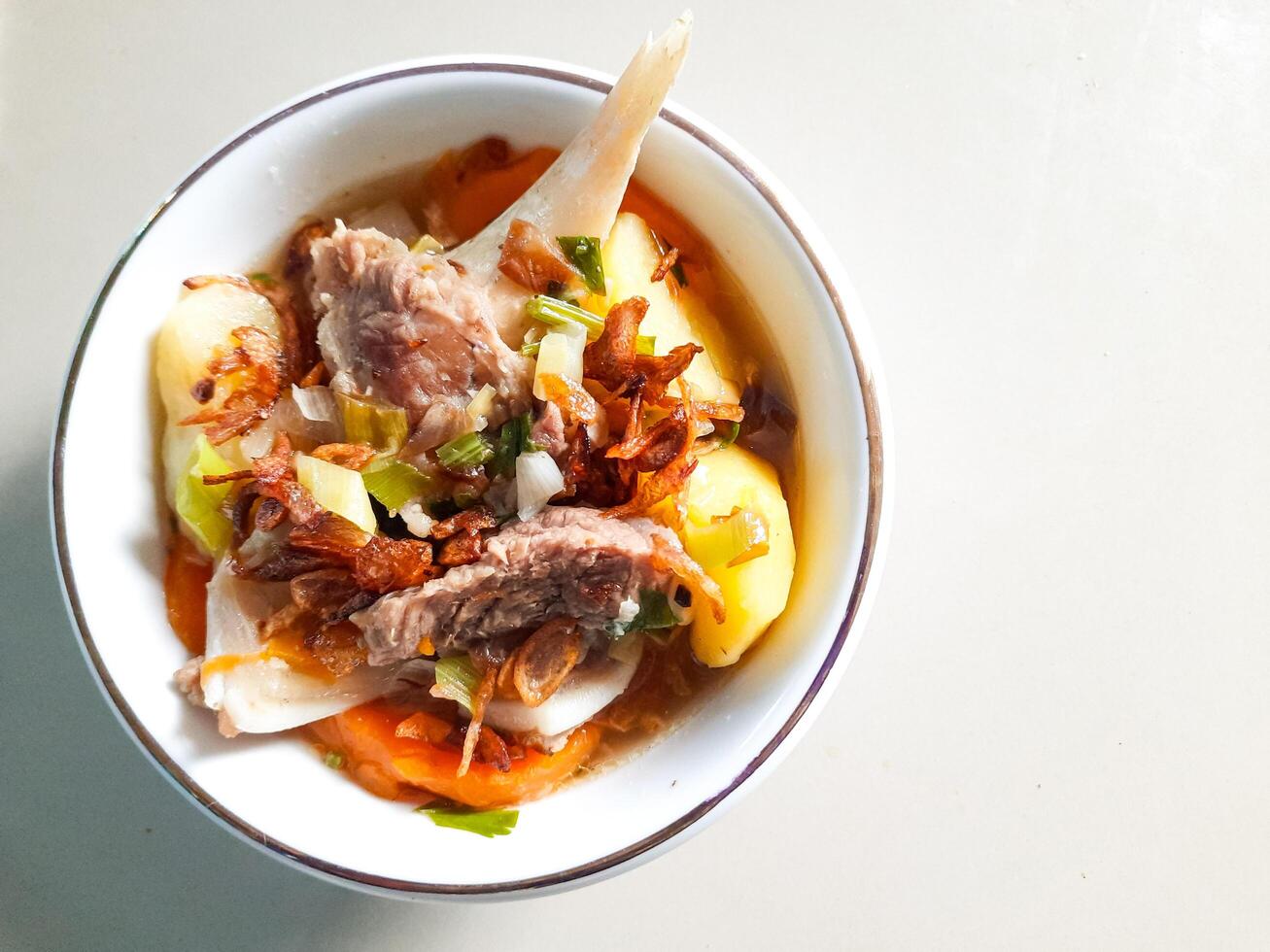 Flat Lay of Beef Soup with Vegetables photo