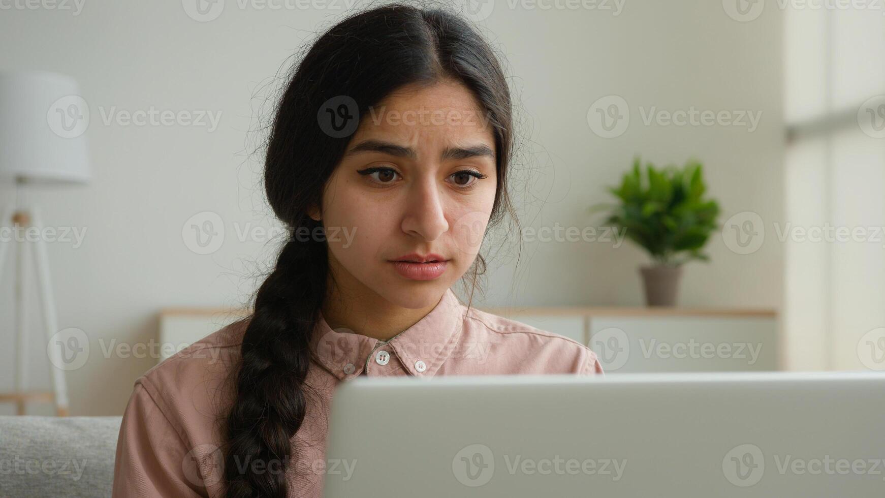 Upset stressful woman Arabian Indian girl businesswoman student fail online exam on laptop negative result disappointed female lady has computer problem at home business failure loss project lose job photo