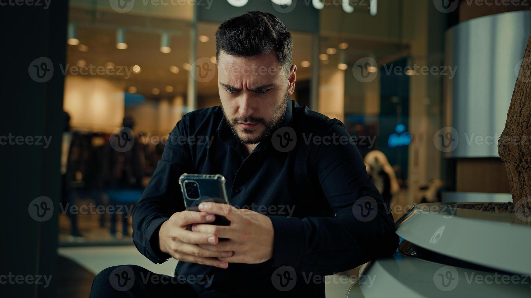 Upset anxious businessman 30s man having problem with mobile telephone read bad news unpleasant email on phone software error receive denial answer fail business deal disappointed male make mistake photo
