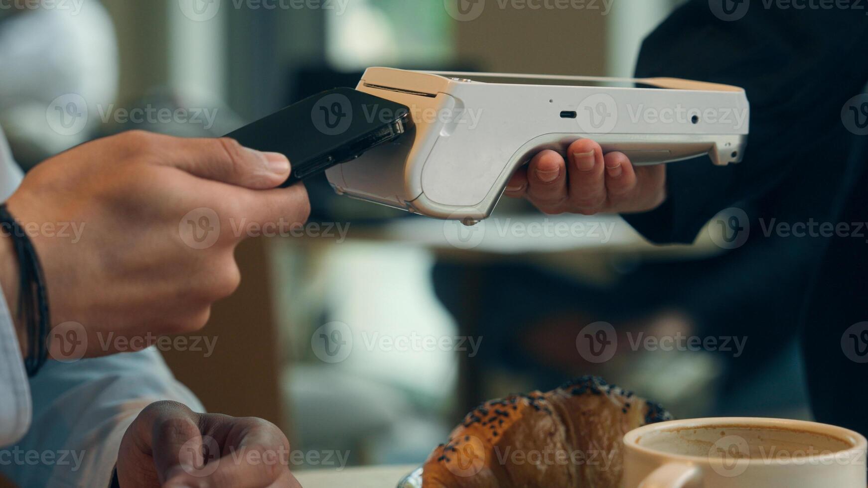 Close up hands visitor man pay bill food order in cafe restaurant unrecognizable waiter holding terminal wifi scan using smartphone contactless NFC payment cashless client service mobile phone bank photo