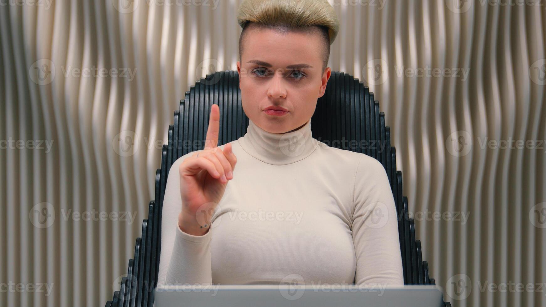 Female programmer serious business worker businesswoman hacker developer woman girl in modern futuristic space work laptop play computer game virtual tech cybersecurity shaking finger no refuse reject photo