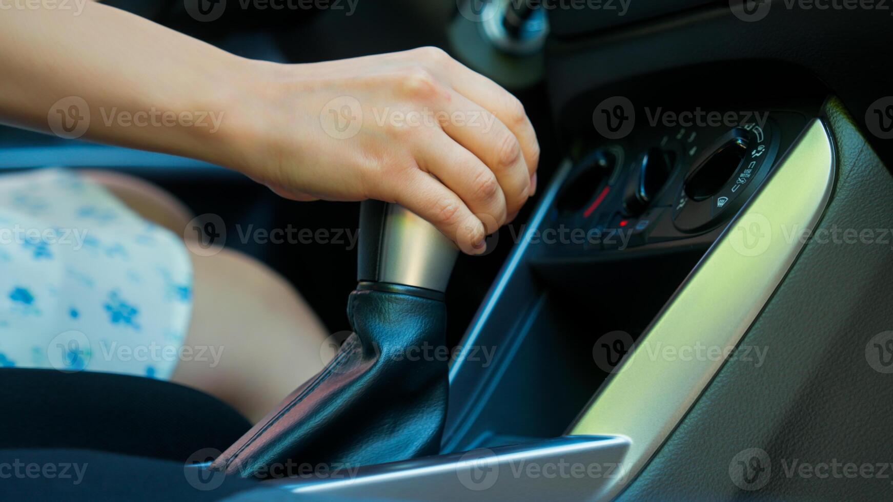 Close up unrecognizable Caucasian woman girl car buyer automobile driver female hand shifting changing gears manual transmission gear stick control gearbox driving inside auto buying new vehicle rent photo