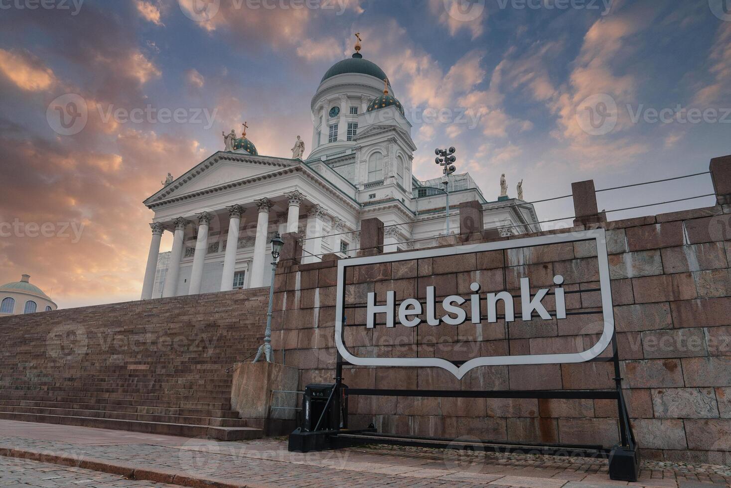 Helsinki Cathedral with Modern Signage and Dramatic Sky photo