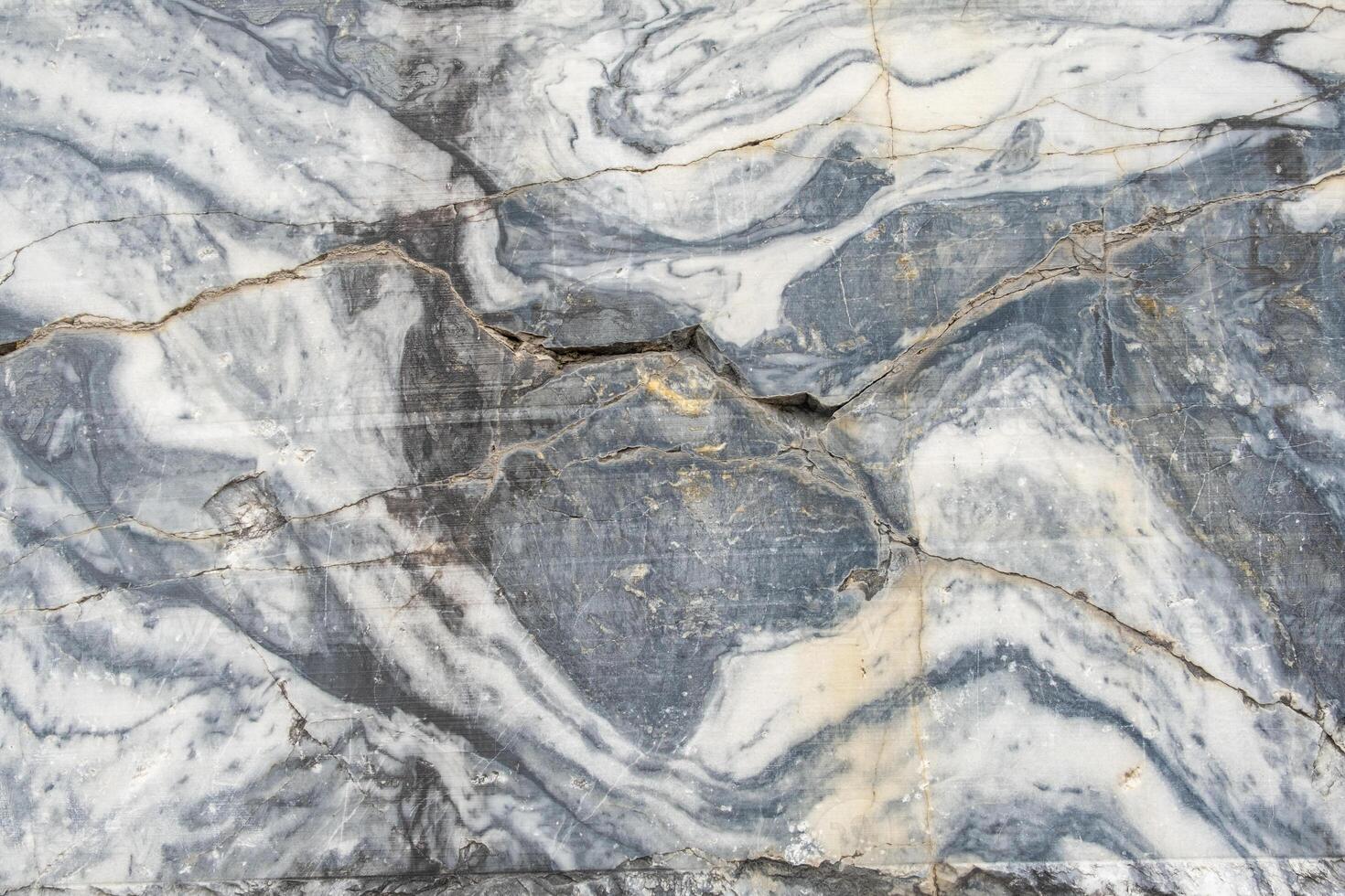 A stunning surface of gray marble exhibits intricate white veining and natural patterns, showcasing the beauty of this stone in a decorative context photo