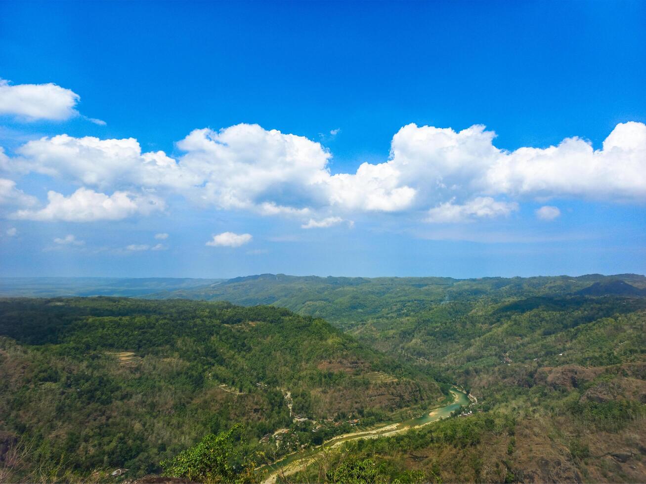 A view of a valley and mountains from a high point photo