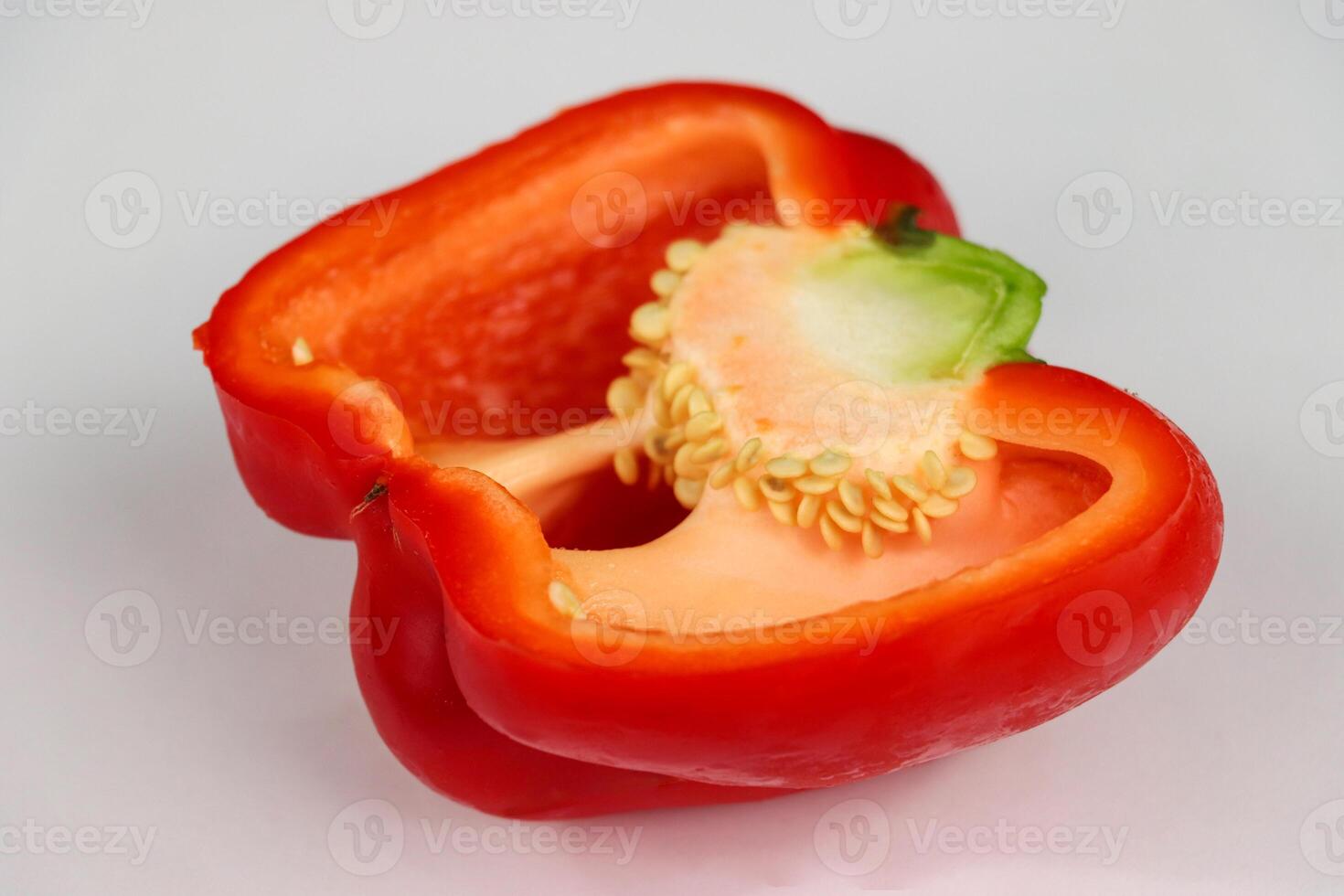 Close Up of a Halved Red Bell Pepper with Seeds photo