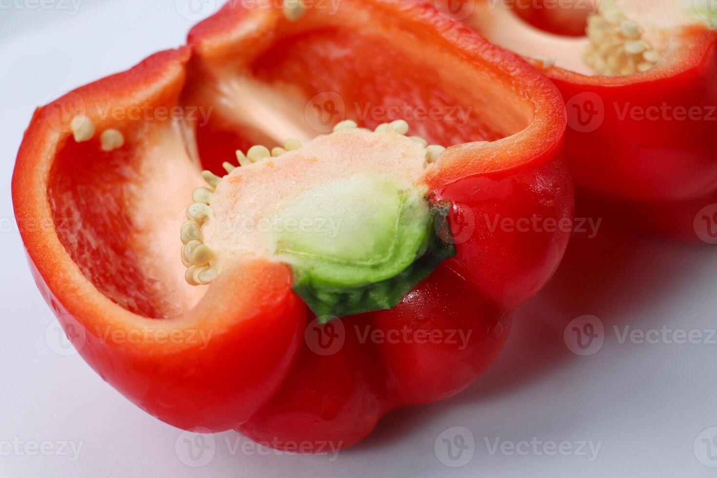 Red Bell Pepper Cut in Half with Seeds Exposed photo