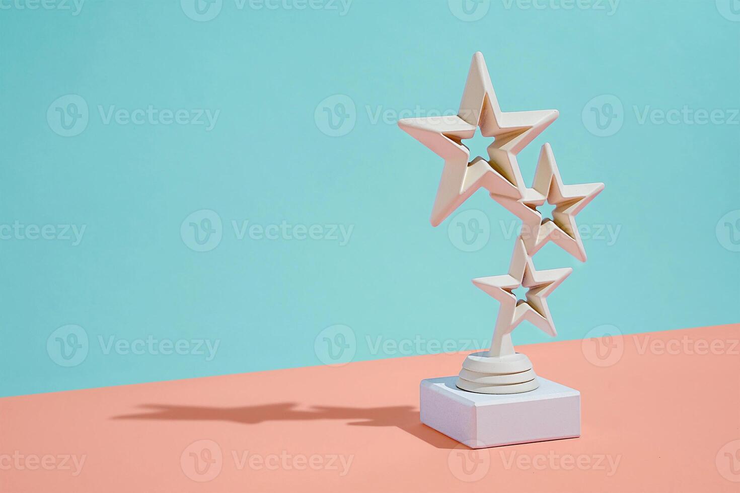 Winners trophy with three stars over diagonal bicolor background photo