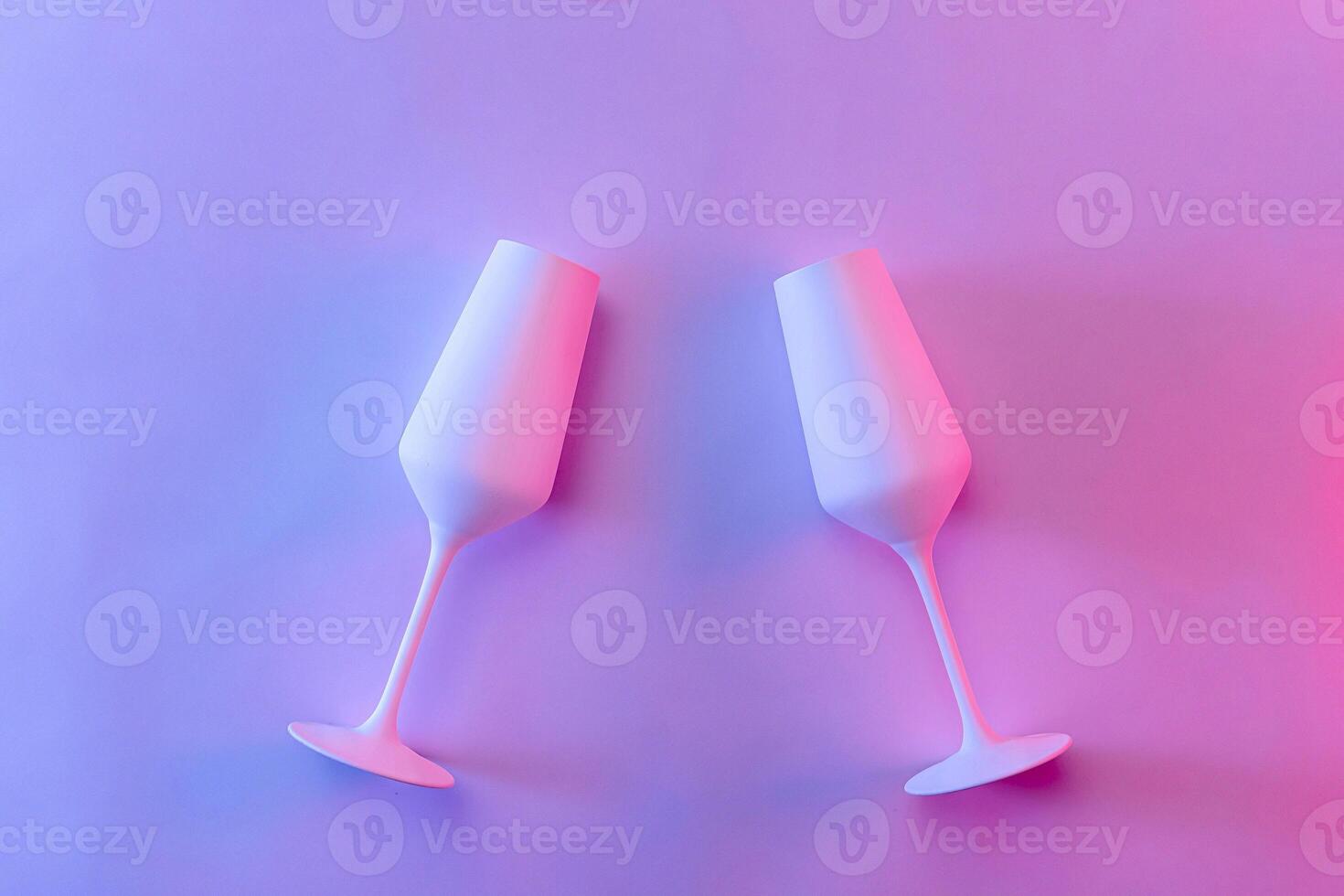 Studio close-up of two mat painted champagne flutes photo