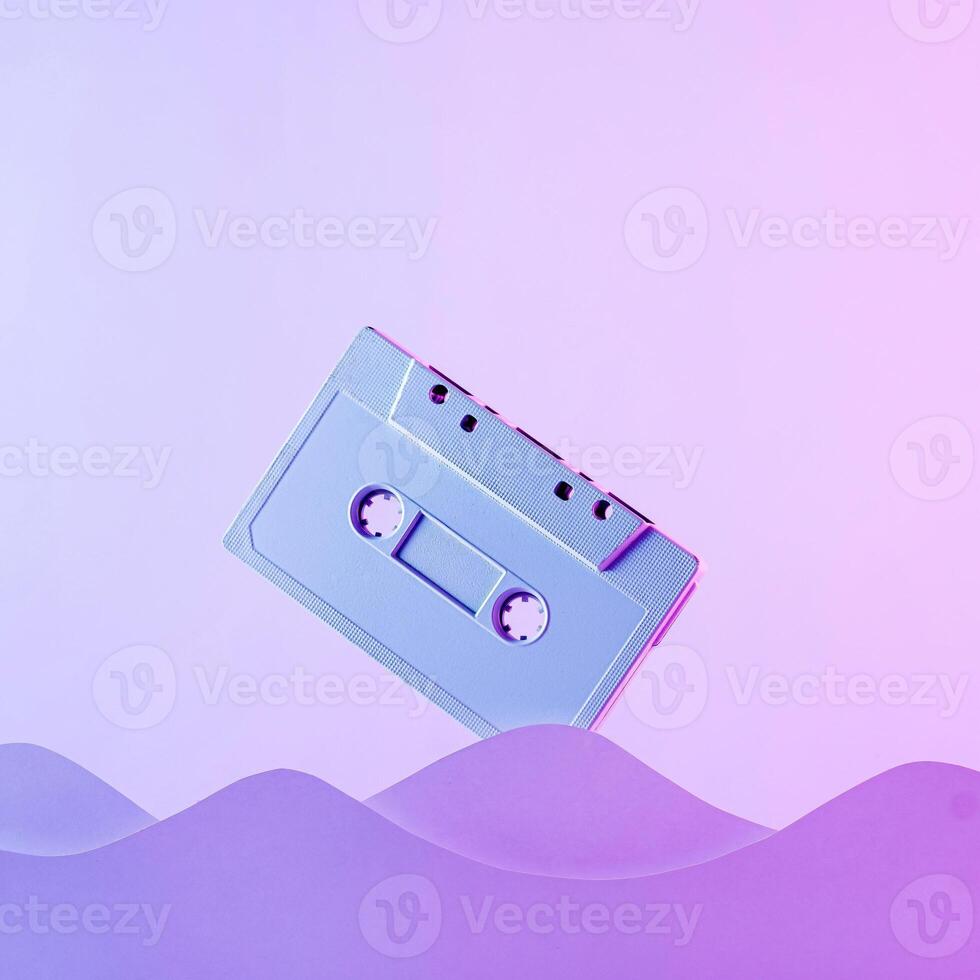 Trend cyber audio poster cassette and wave in neon seating in retro style 90s. photo