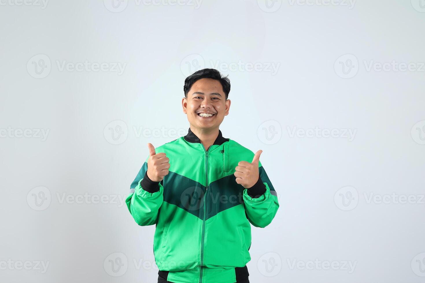 Young Asian Online Driver with Happy Expression and Thumbs Up photo