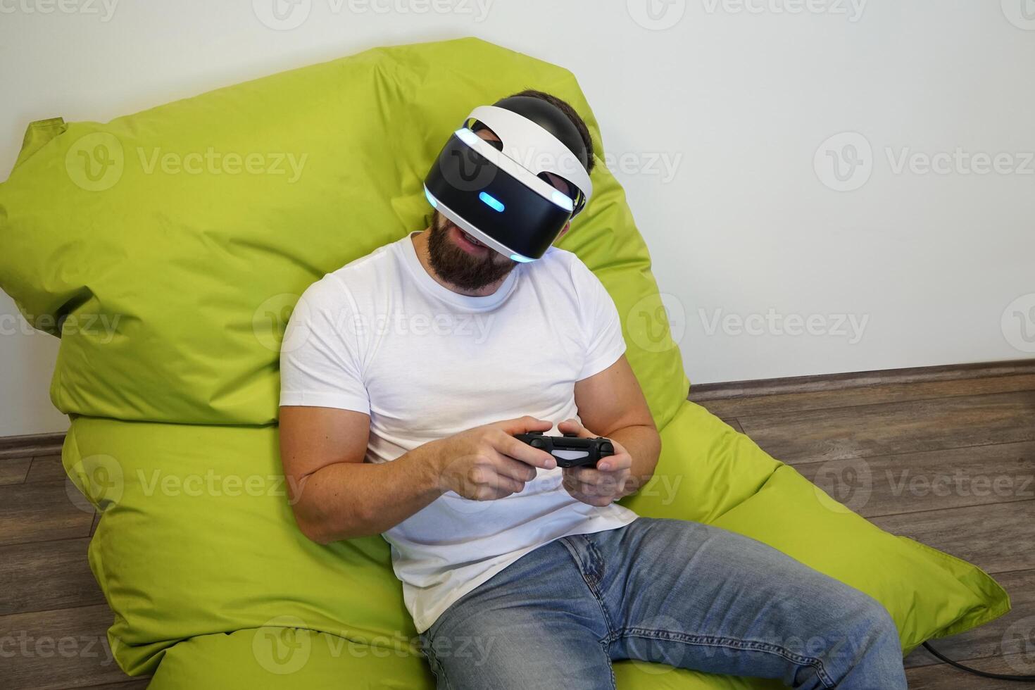 Man Relaxing with VR Headset and Controller on a Bean Bag photo