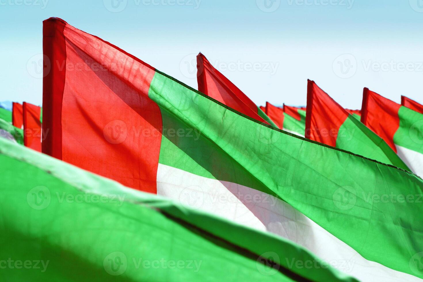Close up fragment of waving UAE flags photo