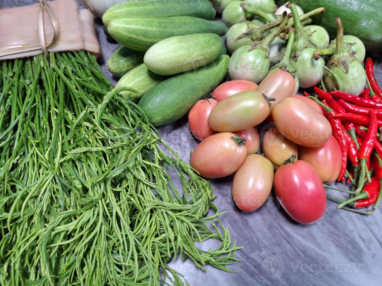 Photo of a pile of various vegetables on a table