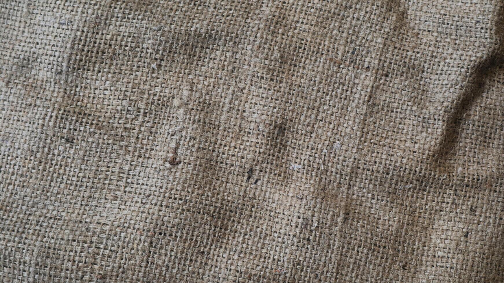 A rustic vintage burlap featuring green and red plain fabric, copy space for minimalist christmas greeting design textured background photo