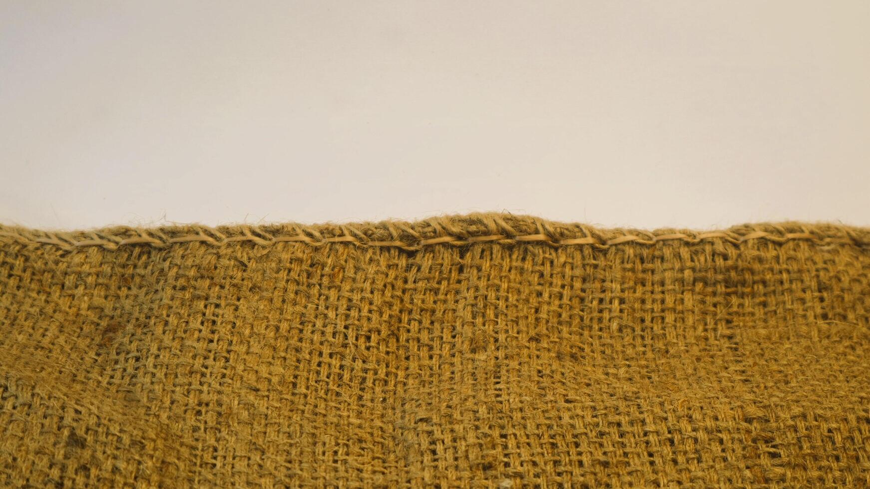 A rustic vintage burlap featuring green and red plain fabric, copy space for minimalist christmas greeting design textured background photo