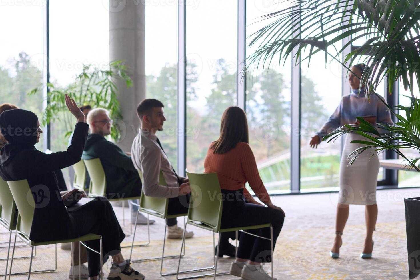 A businesswoman leader guiding a meeting with her colleagues, discussing business challenges, marketing strategies, and new plans for growth and success photo