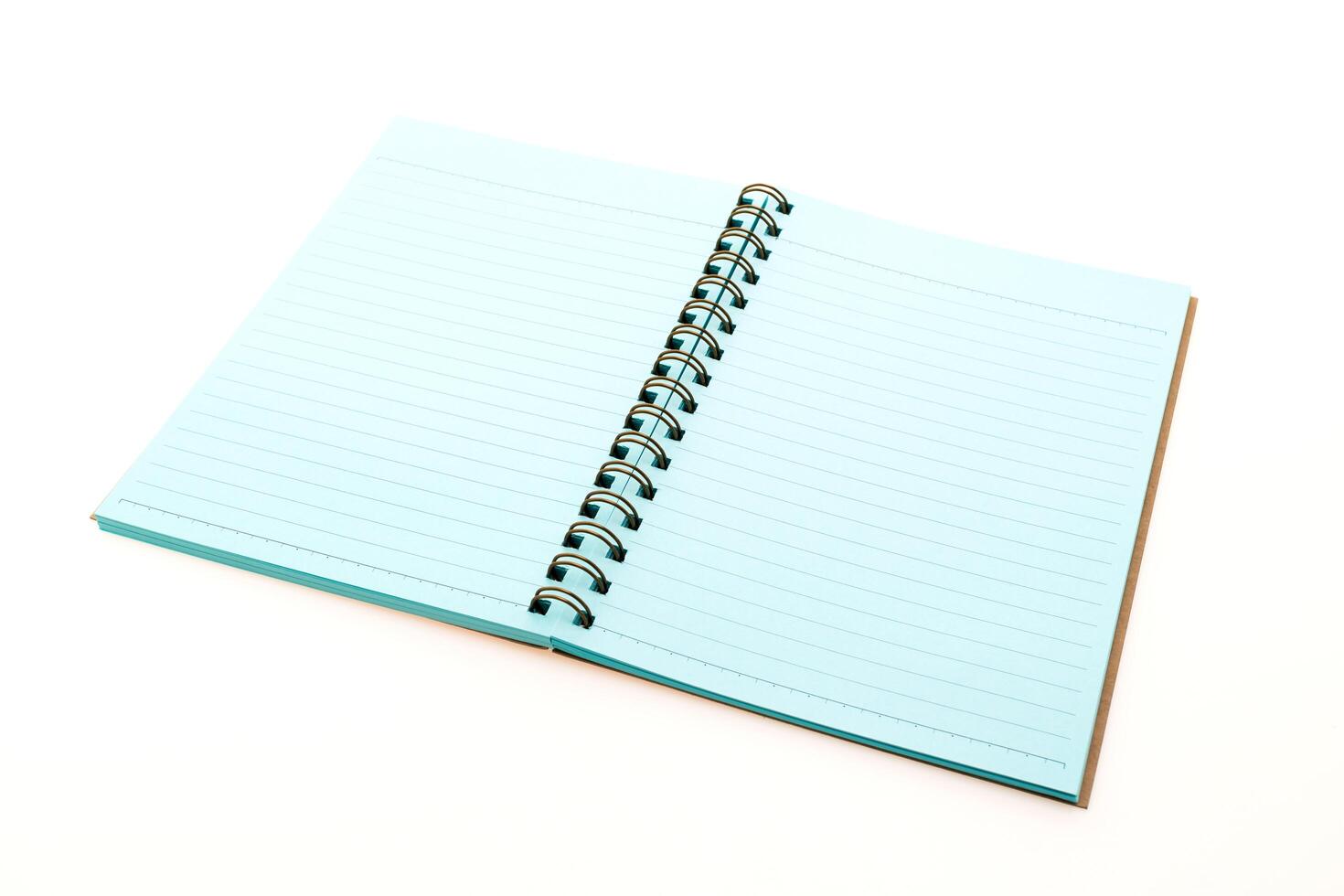 A blue notebook with a spiral bound spiral notebook photo