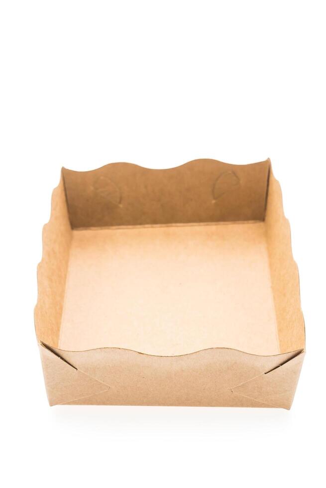 A brown paper box with a scalloped edge photo