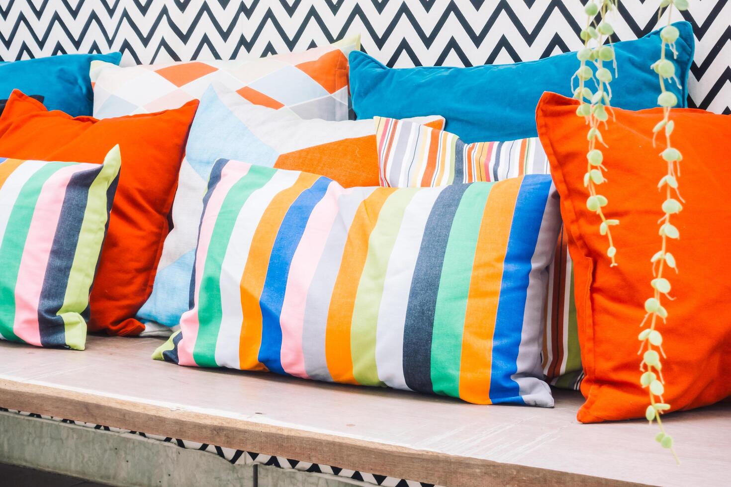 A bench with colorful pillows photo