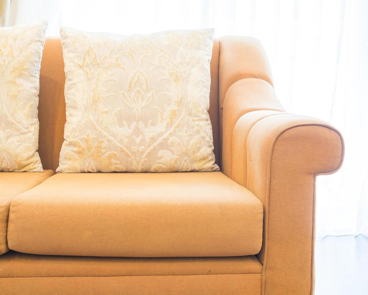 A close up of a couch with two pillows photo