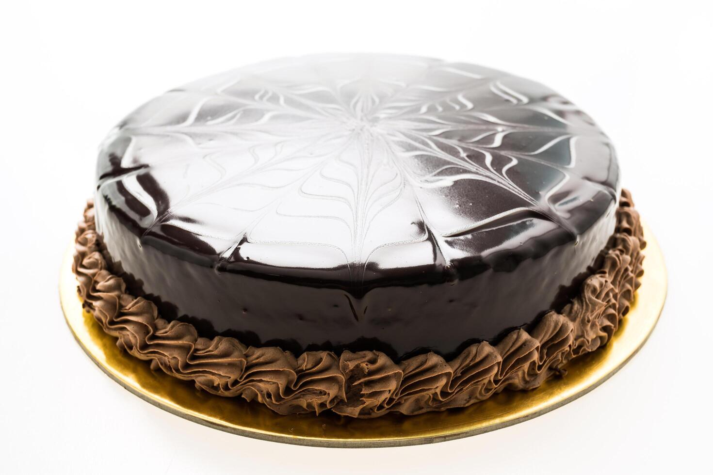 A chocolate cake with a spider web design on top photo